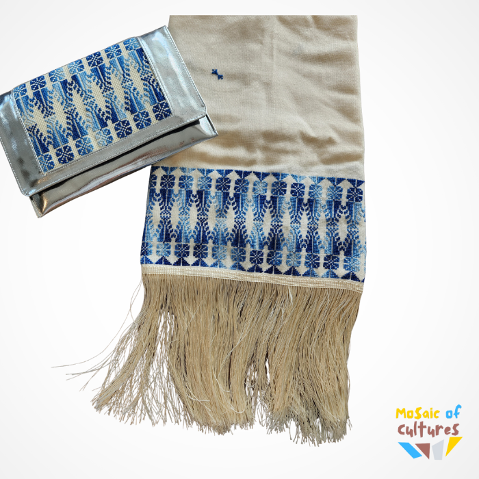 Beige fabric with blue and white patterns and fringes, branded 'Mosaic of Cultures'.