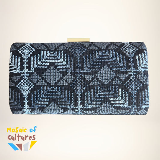 Clutch bag with Palestinian geometric pattern on a beige background, featuring the brand 'Mosaic of Cultures'.
