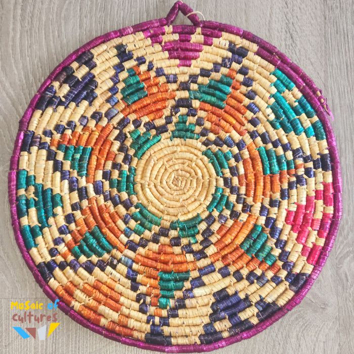 Colorful woven straw tray with a geometric pattern